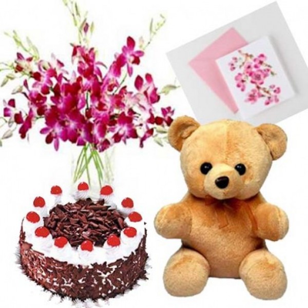  6 Purple Orchids in a Glass Vase with Blackforest Cake (Half Kg), Teddy ( 6 inch) and Greeting Card